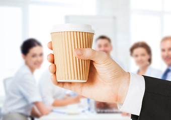 Image showing man hand holding take away coffee