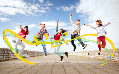 Image showing group of teenagers jumping