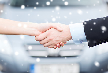 Image showing customer and salesman shaking hands