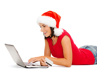 Image showing woman in santa hat with laptop and credit card