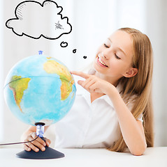 Image showing student girl with globe at school