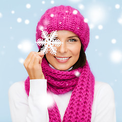 Image showing woman in hat and muffler with big snowflake