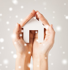 Image showing woman hands holding paper house