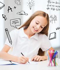 Image showing little student girl drawing at school