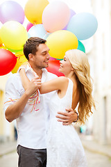 Image showing couple with colorful balloons