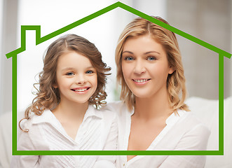 Image showing mother and daughter with eco house