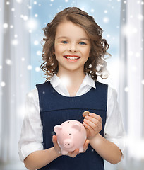 Image showing girl with piggy bank