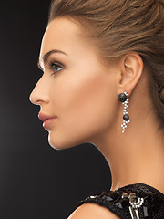 Image showing woman wearing shiny diamond earrings