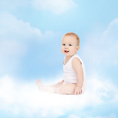 Image showing smiling baby sitting on the cloud