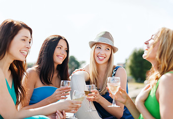 Image showing girls with champagne glasses on boat