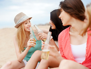 Image showing girls with drinks on the beach