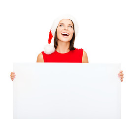 Image showing woman in santa helper hat with blank white board