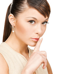 Image showing woman with finger on her lips