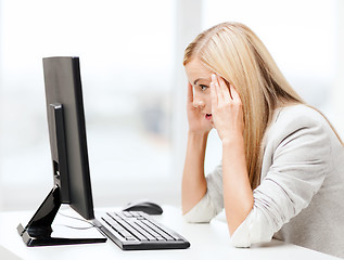 Image showing stressed woman with computer