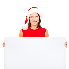 Image showing woman in santa helper hat with blank white board