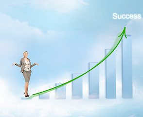 Image showing businesswoman with big 3d chart