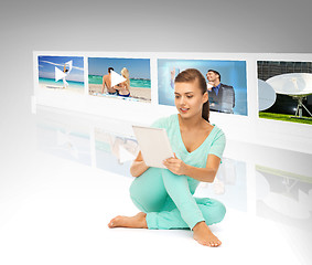 Image showing woman with tablet pc and virtual screens