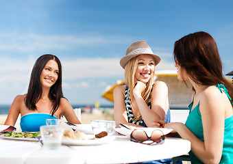 Image showing girls in cafe on the beach