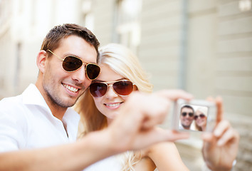 Image showing couple taking photo in cafe