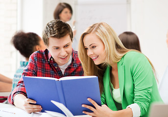 Image showing students reading book at school