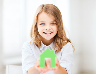 Image showing girl holding green paper house
