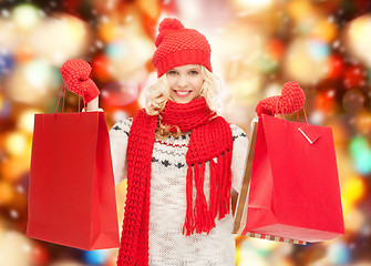 Image showing teenage girl in winter clothes with shopping bags