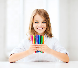 Image showing girl showing colorful felt-tip pens