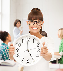 Image showing student showing clock