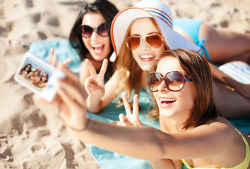Image showing girls taking self photo on the beach