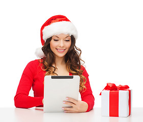 Image showing woman with gift box and tablet pc computer