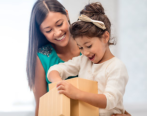 Image showing happy mother and child girl with gift box