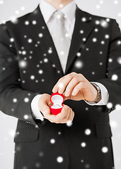 Image showing man with gift box and wedding ring