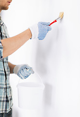 Image showing man with paintbrush and pot