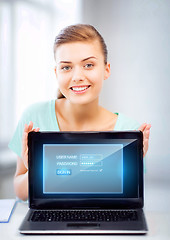 Image showing woman with laptop computer and virtual screen