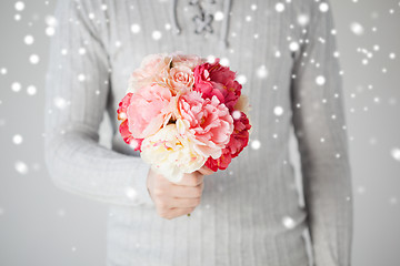 Image showing man holding bouquet of flowers