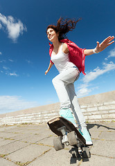 Image showing teenage girl skating outside