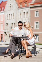 Image showing couple with map in cafe