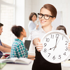 Image showing student showing clock