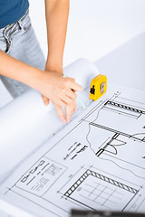 Image showing architect drawing on blueprint