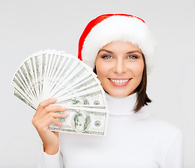Image showing woman in santa helper hat with us dollar money