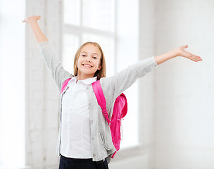 Image showing student girl with hands up at school