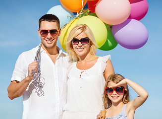 Image showing family with colorful balloons