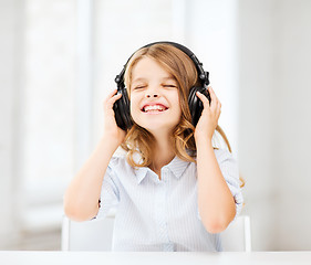 Image showing girl with headphones listening to music
