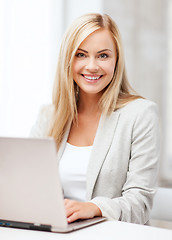 Image showing businesswoman with laptop in office