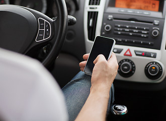 Image showing man using phone while driving the car