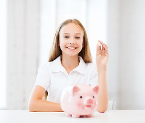 Image showing child with piggy bank