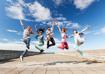 Image showing group of teenagers jumping