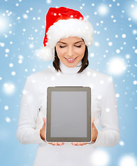 Image showing woman in santa helper hat with tablet pc