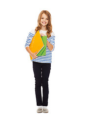 Image showing child holding colorful folders