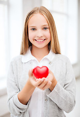 Image showing beautiful teenage girl showing red heart